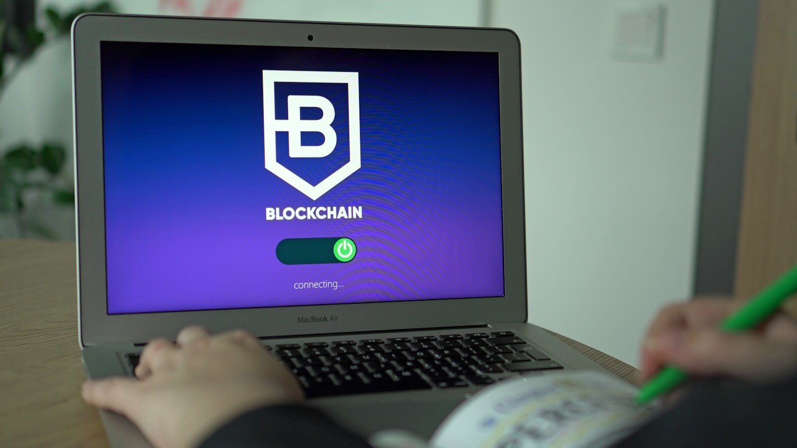 Beginner using a laptop to learn about blockchain
